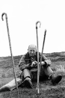 Image of sheet 19910730 photo 2: Vital Hauser mit Spazierstöcken auf der Hirschjagd in Schottland. 1991
Man an hunter with walking sticks on deer hunting in Scotland. Near Kingussie √ 


Kingussie (Listeni/kɪŋˈjuːsi/ king-EW-see; Scottish Gaelic: Ceann a' Ghiùthsaich pronounced [ˈkʲʰaun̴̪ ə ˈʝuːs̪ɪç] ) is a small town in the Highland region of Scotland. It is one settlement in the Highland Council ward of Badenoch and Strathspey, and is the capital of the district of Badenoch. It lies beside the A9 road, although the old route of the A9 serves as the town's main street. Kingussie is 42 miles (68 km) south of Inverness, 12 miles (19 km) south of Aviemore, and 3 miles (4.8 km) north of Newtonmore, which is its greatest rival in the game of shinty.