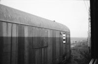 Image of sheet 19920080 photo 22: Der Fluss Elbe durch schmutziges Fenster. Es stehen Rucksäcke am Bahnhof von Usti mit Snackbar und sog. Pfadfinder oder eine Jugendgruppe. weibl. Bahnangestellte. Kohlebergwerk von Most. Mit Kirche. die auf Schienen früher weg transportiert wurde. Zug reihe. Wagons Tagabbaugebiet für Braunkohle Richtung Karlsbad, dem Erzgebirge entlang. Norden Tschechien Jirkov Bahnhof. Nordböhmen ehemaliges Sudetenland. Nach dem zweiten Weltkrieg wurden die mit Nazi Hitler sympatisierenden Sudeten, die deutsch sprachen, mit gerade 20kg Gepäck pro Person, ausgeschafft. Usti. Czech Republic. 1992