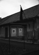 Image of sheet 19920100 photo 6: Im Dorf Dolmi Bojanovice.Eine alte Bäuerin. Der Weinbauer Franz Kubena. Im Weinkeller. In einer Parkettfabrik bei Hodonin. Frauen arbeiten am Fliessband. Abzeichnungen von Havel. Sprays gegen die Romas: 'Die Schwarzen ins Gas'. An einer Bushaltestellein Hodonin. Only for White. lautsprecher und Totenfahne. 1992 Tschechien