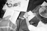 Image of sheet 19920260 photo 16: Pessach Seeder mit kritischen Jüd/Innen GZ Wollishofen. David Bollag, Ruth Guggenheim, Elinor Burgauer, Bettina Trunninger etc. 
Josi Meier und späterer Vater ihrer Kinder Milena und ? küssend. Rote Fabrik. Zürich Schweiz Switzerland
Besuch und Nachtessen bei  r. Riad Mashall in Ramallah. Dermat. Gruppenbild. Westbank. Palestine 1992 Israel