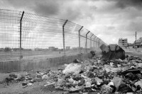 Image of sheet 19920300 photo 31: Auf dem Weg ins Jabalia refugee Camp fahre ich an offenen Mühlhalden an einem Zaun vorbei. Die Müllabfuhr ist nicht gewährleistet. Aber das Ausgehverbot existiert immer noch. outgoing ban returned by Libération

© 1992, OLIVIA HEUSSLER / www.clic.li √

On the way to the Jabalia-Camp I cross several overloaded trashcan. fence
An open garbage dump environmentally destructive Gaza, Palestine 1992 √ israeli occupied territory Umwelt zerstörung Umweltverschmutzung ambient toxic In einem Flüchtlingslager Refugee camp refugees strip israeli occupied territory
Jabalia Camp (Arabic: مخيّم جباليا‎) is a Palestinian refugee camp located 3 kilometers (1.9 mi) north of Jabalia. The refugee camp is in the North Gaza Governorate, Gaza Strip. According to the Palestinian Central Bureau of Statistics, the camp had a population of 93,455 in mid-year 2006