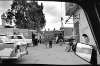 Image of sheet 19920300 photo 33: Durchgangsstrassen im Jabalia-Camp sind von der israelischen Besatzungsmacht verbarrikatiert worden, Gazastreifen Palästina 1992.

Barrikade aus mit Beton gefüllten Ölfässern.  Gaza Jabalia-Camp Palästina 04.92
Jabalia Camp (Arabic: مخيّم جباليا‎) is a Palestinian refugee camp located 3 kilometers (1.9 mi) north of Jabalia. The refugee camp is in the North Gaza Governorate, Gaza Strip. According to the Palestinian Central Bureau of Statistics, the camp had a population of 93,455 in mid-year 2006
Gazastreifen, Gaza strip Palestine 1992 √ barricade with filled oil barrels 

Aus: Out of Jerusalem/ Jenseits von Jerusalem