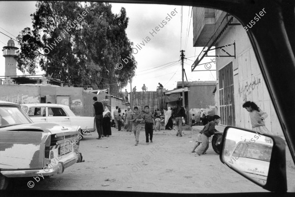 Image of sheet 19920300 photo 33: Barrikade aus mit Beton gefüllten Ölfässern.  Gaza Jabalia-Camp Palästina 04.92
Jabalia Camp (Arabic: مخيّم جباليا‎) is a Palestinian refugee camp located 3 kilometers (1.9 mi) north of Jabalia. The refugee camp is in the North Gaza Governorate, Gaza Strip. According to the Palestinian Central Bureau of Statistics, the camp had a population of 93,455 in mid-year 2006
Gazastreifen, Gaza strip Palestine 1992 √ barricade with filled oil barrels 

Aus: Out of Jerusalem/ Jenseits von Jerusalem