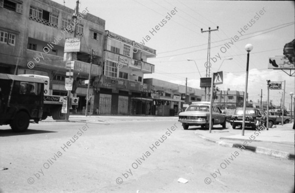 Image of sheet 19920310 photo 14: Für die Familie Al Akra ist das Fahrzeug in ihrem Salon das einzige wertvolle Eigentum, Gaza, Palästina, 04.92
© 1992, by OLIVIA HEUSSLER / www.clic.li
Their peugeot in the living room is the only valuable belonging of the Al Akkra family.  Gaza Palestine 1992 √
Jabalia Camp (Arabic: مخيّم جباليا‎) is a Palestinian refugee camp located 3 kilometers (1.9 mi) north of Jabalia. The refugee camp is in the North Gaza Governorate, Gaza Strip. According to the Palestinian Central Bureau of Statistics, the camp had a population of 93,455 in mid-year 2006
Aus: Out of Jerusalem Jenseits von Jerusalem page  102, 103 
The car parked in the living room is the only precious property the family owns.