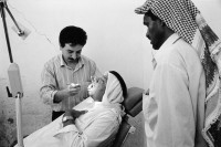 Image of sheet 19920310 photo 31: Zähne Doktor Zahn jahres kontrolle. Die 'Union of Palestinian Medical Relief Committees' organisieren jährlich Gesundheitstage für alle Dorfbewohner Innen. Jiftlik, Jordan tal, Palästina 04.92 1992 √ valley westbank Palestine  israeli occupied territory tooth control medical doctor dentist old man open mouth 

The annual dental check-up. The Union of Palestinian Medical Relief Commitees (UPRMC) organizes once a year a health day for all the village inhabitans.

al-Jiftlik (Arabic: الجفتلك‎) is a Palestinian town in the West Bank's Jordan Rift Valley several kilometers from the Jordanian border. According to the PCBS statistics for 2006, it was home to 4,401 and set on an area of 81,283 metric dunum.

© 1992, by OLIVIA HEUSSLER / www.clic.li