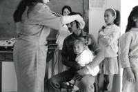 Image of sheet 19920310 photo 37: © 1992, Olivia Heussler / www.clic.li
Die 'Union of Palestinian Medical Relief Committees' organisieren jährlich Gesundheitstage für alle DorfbewohnerInnen. Hier ein präventiver Ohrentest. Jiftlik, Jordantal, Westbank, Palästina. 1992 √

he Union of Palestinian Medical Relief Commitees (UPRMC) organizes once a year a health day for all the village inhabitans. Shown here, an ear examination. Jiftlik, Jordan Valley. Palästina. ear test child man father nurth school girl uniform
al-Jiftlik (Arabic: الجفتلك‎) is a Palestinian town in the West Bank's Jordan Rift Valley several kilometers from the Jordanian border. According to the PCBS statistics for 2006, it was home to 4,401 and set on an area of 81,283 metric dunum.

© 1992, by OLIVIA HEUSSLER / www.clic.li