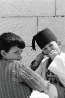 Image of sheet 19920340 photo 14: In Gerizim bei Nablus, leben die letzten Samaritaner Familien.
Occupied territory Palestine Palästina 1992 √ Aus: Out of Jerusalem / Jenseits von Jerusalem page 73

The Samaritans (Hebrew: שומרונים‎ Shomronim, Arabic: السامريون‎ as-Sāmariyyūn) are an ethnoreligious group of the Levant, descended from ancient Semitic inhabitants of the region. Religiously the Samaritans are adherents of Samaritanism, an Abrahamic religion closely related to Judaism. Based on the Samaritan Torah, Samaritans claim their worship is the true religion of the ancient Israelites prior to the Babylonian Exile, preserved by those who remained in the Land of Israel, as opposed to Judaism, which they assert is a related but altered and amended religion, brought back by those returning from exile.

© 1992, OLIVIA HEUSSLER / www.clic.li
ohne Aufkleber