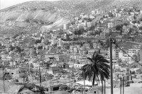 Image of sheet 19920340 photo 25: Siedlungen bei Nablus. Gerizim, Samariterkinder, Al Cazer, Wachturm aus osamnischer Zeit. Portrait Tochter Nazer. Munir und Omar Paschsa. Nablus. Jerusalem. Armenische Oster Prozession. Altstadt. Jerusalem Palästina Palestine
Occupied territory Palestine Palästina 1992 
Mount Gerizim (play /ˈɡɛrɨˌzɪm/; Samaritan Hebrew Ar-garízim, Arabic جبل جرزيم Jabal Jarizīm, Tiberian Hebrew הַר גְּרִזִּים Har Gərizzîm, Standard Hebrew הַר גְּרִיזִּים Har Gərizzim) is one of the two mountains in the immediate vicinity of the West Bank city of Nablus (biblical Shechem), and forms the southern side of the valley in which Nablus is situated, the northern side being formed by Mount Ebal. The mountain is one of the highest peaks in the West Bank and rises to 2849 feet (881 m) above sea level, 228 feet (69.5 m) shorter than Mount Ebal. The mountain is particularly steep on the northern side, is sparsely covered at the top with shrubbery, and lower down there is a spring with a high yield of fresh water.

The Samaritans (Hebrew: שומרונים‎ Shomronim, Arabic: السامريون‎ as-Sāmariyyūn) are an ethnoreligious group of the Levant, descended from ancient Semitic inhabitants of the region. Religiously the Samaritans are adherents of Samaritanism, an Abrahamic religion closely related to Judaism. Based on the Samaritan Torah, Samaritans claim their worship is the true religion of the ancient Israelites prior to the Babylonian Exile, preserved by those who remained in the Land of Israel, as opposed to Judaism, which they assert is a related but altered and amended religion, brought back by those returning from exile