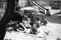 Image of sheet 19920360 photo 13: AMIDEAST eine von US-Amerikanischem Geld unterstützte Organisation für StudentInnen Stipendien, angezündet. Jerusalem «Terres des Hommes» Kindergarten. Down-Syndrom Kind. Downsyndrom Ost Jerusalem Sektion. Terres des Hommes Ernährungsspital in Bethlehem. Hospital undernurished kids Unterernährte Kinder. 1- 7 Jährige. Occupied territory Palestine Palästina 1992 
Bethlehem (Arabic: بيت لحم‎ About this sound Bayt Laḥm (help·info) or Bēt Laḥm, lit "House of Meat"; Hebrew: בֵּית לֶחֶם Bēṯ Leḥem, Modern: Bet Leḥem, IPA: [bet ˈleχem], lit "House of Bread;" Greek: Βηθλεὲμ, Vithleém) is a Palestinian city located in the central West Bank, neighboring south Jerusalem, with a population of about 25,000 people. It is the capital of the Bethlehem Governorate of the Palestinian National Authority. The economy is primarily tourist-driven