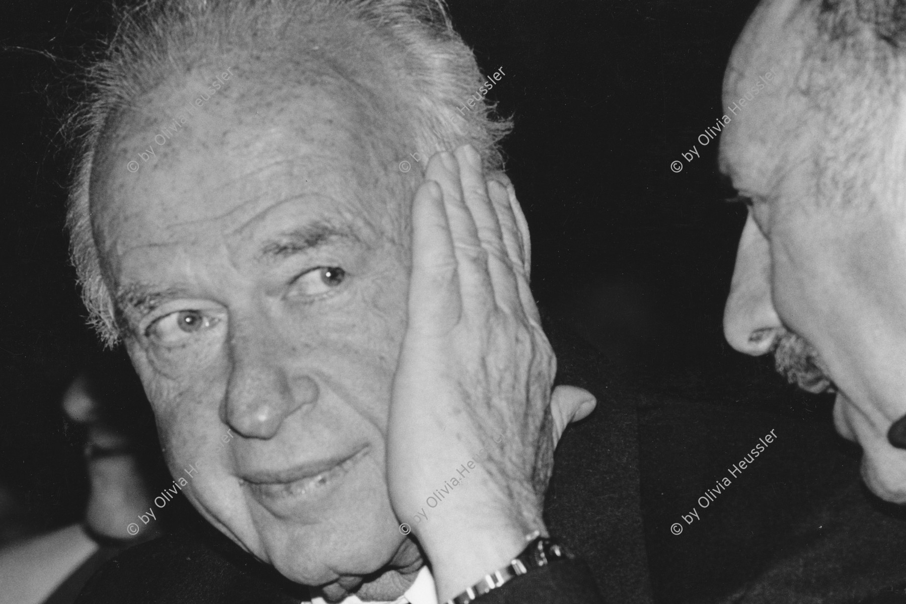 Image of sheet 19920390 photo 7: Wieso will Yitzhak Rabin (Labour) nichts mehr hören ? Mit vielen Promineten aus dem In- und Ausland nimmt er an den Jubiläumstrauerfeierlichkeiten für die Befreiung von Ausschwitz teil, die sich zum 50 Mal wiederholen. Israel Jerusalem 1992 √ 
Future primeminister Ytzak Rabin at the festivities and commemoration for the liberation of Auschwitz, 50 years ago, at mount Herzl. Yad Vashem. April 29,

Yitzhak Rabin (help·info) (Hebrew: יִצְחָק רַבִּין ‎‎ IPA: [jitsˈχak ʁaˈbin]; March 1, 1922 – November 4, 1995) was an Israeli politician, statesman and general. He was the fifth Prime Minister of Israel, serving two terms in office, 1974–77 and 1992 until his assassination in 1995. In 1994, Rabin won the Nobel Peace Prize together with Shimon Peres and Yasser Arafat. He was assassinated by right-wing Israeli radical Yigal Amir, who was opposed to Rabin's signing of the Oslo Accords. Rabin was the first native-born prime minister of Israel, the only prime minister to be assassinated and the second to die in office after Levi Eshkol

Yad Vashem (Hebrew: יד ושם) is Israel's official memorial to the Jewish victims of the Holocaust, established in 1953 through the Yad Vashem Law passed by the Knesset, Israel's parliament

Aus: Out of Jerusalem / Jenseits von Jerusalem page 17

copyright by Olivia Heussler