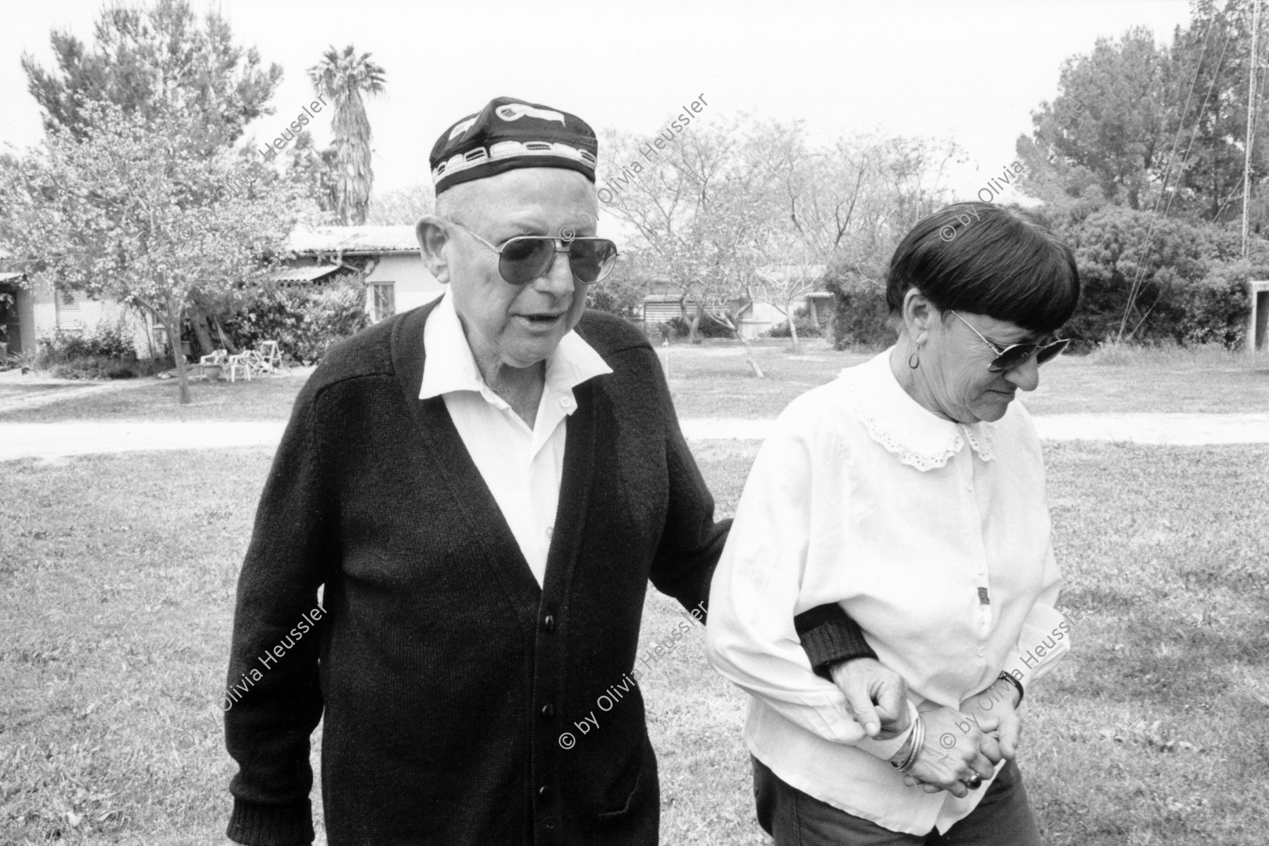 Image of sheet 19920400 photo 11: Elieser Feiler, hier von seiner Frau Pnina unterstützt, setzt sich seit Jahren für den israelisch-palästinensischen Dialog und Frieden zwischen Israel und den arabischen Ländern ein. Israel 1.05.92. Israel Peace process 1992 √

Elieser Feiler an his wife Pnina walking to the Kibbutz-Restaurant.
Elieser Feiler for many years endeavored to facilitate Israeli Palestinian dialogue. Two peoples two states one future
Yad Hana (Hebrew: יַד חַנָּה, lit. Hannah's Memorial) is a Community settlement and former kibbutz in Israel's Sharon plain. Covering 2,600 dunams, it is located within the Hefer Valley Regional Council near Highway 57 north of the country's center. In 2006 it had a population of 208. In 2010, the Kibbutz movement newspaper Daf HaYarok reported that it numbered 140 member