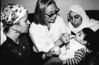 Image of sheet 19920431 photo 1: Eine Dorfpflegerin Physiotherapheutin von The Association of Israeli-Palestinian Physicians for Human Rights (AIPPHR) ausgebildet während einem Hausbesuch Palästina, Westbank, Beit Suriq 05.92 1992 √ medical health physio therapy child ngo village nurse mother baby boy invalid handicapped behindertes kind behindert


Beit Surik (Arabic: بيت سوريك‎) is a Palestinian village in the Jerusalem Governorate, located 12 kilometers Northwest of Jerusalem in the northern West Bank. According to the Palestinian Central Bureau of Statistics, the town had a population of 3,818 in 2006
The Association of Israeli-Palestinian Physicians for Human Rights (AIPPHR)

© 1992, by OLIVIA HEUSSLER / www.clic.li