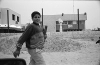 Image of sheet 19920440 photo 11: Charles Landsmann in der grössten und ältesten Siedlung Elkana. Kinderspielplatz mit Eltern. Israel. Fahne in Eigenheim in Oranit. Denkmal im arabischen Dorf Kafr Kassen. Ort von Fundi Sheik Daoisch. Denkmal für 1956 von Israelis massakrierten Bauern. Suezkrieg. 8.5. «Women in Black» protestieren für ein Ende der Besetzung. «End the Occupation» am King Georg Platz. Polizei überwacht Sie. Orthodoxe Juden protestieren gegen die Frauen in Schwarz. Für eine Besetzung. Polizei kontrolliert junge Palästinenser an Salah al Hedin Street. 

Gaza Militär Camp einer Artillerie Brigade  aus dem Norden . Soldatenpatroullie spricht mit Palästinenserinnen, sie suchen ihre Söhne.
Israel Jerusalem Gaza Khan Younis 1992

Women in Black (Hebrew: נשים בשחור‎, Nashim BeShahor) is a women's anti-war movement with an estimated 10,000 activists around the world. The first group was formed by Israeli women in Jerusalem in 1988, following the outbreak of the First intifada.

The Kafr Qasim massacre took place in the Israeli Arab village of Kafr Qasim situated on the Green Line, at that time, the de facto border between Israel and the West Bank on October 29, 1956. It was carried out by the Israel Border Police (Magav) and resulted in 48 Arab civilians dead, including 6 women and 23 children aged 8–17. Arab sources usually give the death toll as 49, as they include the unborn child of one of the women.


Al-Shati camp (Arabic: مخيّم الشاطئ‎), also known as Beach camp, is a Palestinian refugee camp located in the northern Gaza Strip along the Mediterranean Sea coastline in the Gaza Governorate, and more specifically Gaza City. The camp's total land area consists of 727 dunums. According to the Palestinian Central Bureau of Statistics (PCBS), al-Shati had a population of 87,158 inhabitants in mid-year 2006, while the United Nations Relief and Works Agency (UNRWA) reports a population of 78,800 registered refugees. The camp is the third largest refugee camp in the Palestinian Territories