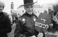 Image of sheet 19920440 photo 19: Charles Landsmann in der grössten und ältesten Siedlung Elkana. Kinderspielplatz mit Eltern. Israel. Fahne in Eigenheim in Oranit. Denkmal im arabischen Dorf Kafr Kassen. Ort von Fundi Sheik Daoisch. Denkmal für 1956 von Israelis massakrierten Bauern. Suezkrieg. 8.5. «Women in Black» protestieren für ein Ende der Besetzung. «End the Occupation» am King Georg Platz. Polizei überwacht Sie. Orthodoxe Juden protestieren gegen die Frauen in Schwarz. Für eine Besetzung. Polizei kontrolliert junge Palästinenser an Salah al Hedin Street. 

Gaza Militär Camp einer Artillerie Brigade  aus dem Norden . Soldatenpatroullie spricht mit Palästinenserinnen, sie suchen ihre Söhne.
Israel Jerusalem Gaza Khan Younis 1992

Women in Black (Hebrew: נשים בשחור‎, Nashim BeShahor) is a women's anti-war movement with an estimated 10,000 activists around the world. The first group was formed by Israeli women in Jerusalem in 1988, following the outbreak of the First intifada.

The Kafr Qasim massacre took place in the Israeli Arab village of Kafr Qasim situated on the Green Line, at that time, the de facto border between Israel and the West Bank on October 29, 1956. It was carried out by the Israel Border Police (Magav) and resulted in 48 Arab civilians dead, including 6 women and 23 children aged 8–17. Arab sources usually give the death toll as 49, as they include the unborn child of one of the women.


Al-Shati camp (Arabic: مخيّم الشاطئ‎), also known as Beach camp, is a Palestinian refugee camp located in the northern Gaza Strip along the Mediterranean Sea coastline in the Gaza Governorate, and more specifically Gaza City. The camp's total land area consists of 727 dunums. According to the Palestinian Central Bureau of Statistics (PCBS), al-Shati had a population of 87,158 inhabitants in mid-year 2006, while the United Nations Relief and Works Agency (UNRWA) reports a population of 78,800 registered refugees. The camp is the third largest refugee camp in the Palestinian Territories
