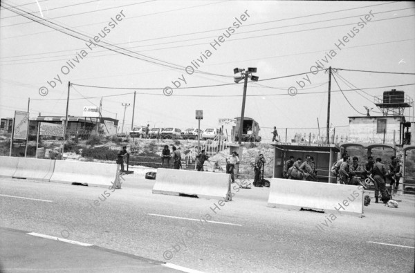 Image of sheet 19920440 photo 30: Charles Landsmann in der grössten und ältesten Siedlung Elkana. Kinderspielplatz mit Eltern. Israel. Fahne in Eigenheim in Oranit. Denkmal im arabischen Dorf Kafr Kassen. Ort von Fundi Sheik Daoisch. Denkmal für 1956 von Israelis massakrierten Bauern. Suezkrieg. 8.5. «Women in Black» protestieren für ein Ende der Besetzung. «End the Occupation» am King Georg Platz. Polizei überwacht Sie. Orthodoxe Juden protestieren gegen die Frauen in Schwarz. Für eine Besetzung. Polizei kontrolliert junge Palästinenser an Salah al Hedin Street. 

Gaza Militär Camp einer Artillerie Brigade  aus dem Norden . Soldatenpatroullie spricht mit Palästinenserinnen, sie suchen ihre Söhne.
Israel Jerusalem Gaza Khan Younis 1992

Women in Black (Hebrew: נשים בשחור‎, Nashim BeShahor) is a women's anti-war movement with an estimated 10,000 activists around the world. The first group was formed by Israeli women in Jerusalem in 1988, following the outbreak of the First intifada.

The Kafr Qasim massacre took place in the Israeli Arab village of Kafr Qasim situated on the Green Line, at that time, the de facto border between Israel and the West Bank on October 29, 1956. It was carried out by the Israel Border Police (Magav) and resulted in 48 Arab civilians dead, including 6 women and 23 children aged 8–17. Arab sources usually give the death toll as 49, as they include the unborn child of one of the women.


Al-Shati camp (Arabic: مخيّم الشاطئ‎), also known as Beach camp, is a Palestinian refugee camp located in the northern Gaza Strip along the Mediterranean Sea coastline in the Gaza Governorate, and more specifically Gaza City. The camp's total land area consists of 727 dunums. According to the Palestinian Central Bureau of Statistics (PCBS), al-Shati had a population of 87,158 inhabitants in mid-year 2006, while the United Nations Relief and Works Agency (UNRWA) reports a population of 78,800 registered refugees. The camp is the third largest refugee camp in the Palestinian Territories