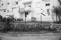 Image of sheet 19920440 photo 6: Charles Landsmann in der grössten und ältesten Siedlung Elkana. Kinderspielplatz mit Eltern. Israel. Fahne in Eigenheim in Oranit. Denkmal im arabischen Dorf Kafr Kassen. Ort von Fundi Sheik Daoisch. Denkmal für 1956 von Israelis massakrierten Bauern. Suezkrieg. 8.5. «Women in Black» protestieren für ein Ende der Besetzung. «End the Occupation» am King Georg Platz. Polizei überwacht Sie. Orthodoxe Juden protestieren gegen die Frauen in Schwarz. Für eine Besetzung. Polizei kontrolliert junge Palästinenser an Salah al Hedin Street. 

Gaza Militär Camp einer Artillerie Brigade  aus dem Norden . Soldatenpatroullie spricht mit Palästinenserinnen, sie suchen ihre Söhne.
Israel Jerusalem Gaza Khan Younis 1992

Women in Black (Hebrew: נשים בשחור‎, Nashim BeShahor) is a women's anti-war movement with an estimated 10,000 activists around the world. The first group was formed by Israeli women in Jerusalem in 1988, following the outbreak of the First intifada.

The Kafr Qasim massacre took place in the Israeli Arab village of Kafr Qasim situated on the Green Line, at that time, the de facto border between Israel and the West Bank on October 29, 1956. It was carried out by the Israel Border Police (Magav) and resulted in 48 Arab civilians dead, including 6 women and 23 children aged 8–17. Arab sources usually give the death toll as 49, as they include the unborn child of one of the women.


Al-Shati camp (Arabic: مخيّم الشاطئ‎), also known as Beach camp, is a Palestinian refugee camp located in the northern Gaza Strip along the Mediterranean Sea coastline in the Gaza Governorate, and more specifically Gaza City. The camp's total land area consists of 727 dunums. According to the Palestinian Central Bureau of Statistics (PCBS), al-Shati had a population of 87,158 inhabitants in mid-year 2006, while the United Nations Relief and Works Agency (UNRWA) reports a population of 78,800 registered refugees. The camp is the third largest refugee camp in the Palestinian Territories