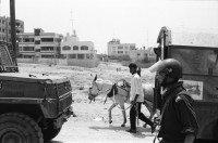 Image of sheet 19920450 photo 15: Die israelischen Soldaten eines Artillerie-Bataillons. der Soldat suvht die Gegend nach jungen PalästinenserInnen ab. Noch immer herrscht nächtl. Ausgehverbot.

Military Patrol Israeli occupied territory Gaza Strip Palestine Al Shate Refugeecamp Refugees 1992 √ army civilian refugee and animal soldier human rights
Aus: Out of Jerusalem / Jenseits von Jerusalem page: 95
Israeli soldiers patrolling the Al shate camp. There is a curfew every night.
Israeli patrol in occupied territories in Gaza.

zurück von Libération, Paris 2015
«Counter-power» Altkirch 2017