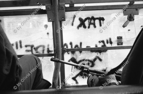 Image of sheet 19920450 photo 23: Les deux mères de jeunes Palestiniens demandent des soldats israéliens devant d'un camp d'artillerie à Gaza pour leurs fils disparus.

Die zwei Mütter Frauen von jungen Palästinensern fragen israelische Soldaten vor einem Artillerie-Camp nach ihren vermissten Söhnen. √

© 1992, OLIVIA HEUSSLER / www.clic.li
The two women, mothers of young Palestinians ask Israeli soldiers in front of an artillery camp for their missing sons
Al Shate- Refugee Camp, Gazastreifen, Palästina 05.92 Palestine 1992 Occupied territory Gaza Strip √ Women Batallion Military soldier israeli Mother sons Human rights Refugees 
Two mothers ask about their missing sons at a Israeli army artillery camp. 

Aus: Out of Jerusalem / Jenseits von Jerusalem page: 96, 97


Al-Shati camp (Arabic: مخيّم الشاطئ‎), also known as Beach camp, is a Palestinian refugee camp located in the northern Gaza Strip along the Mediterranean Sea coastline in the Gaza Governorate, and more specifically Gaza City. The camp's total land area consists of 727 dunums. According to the Palestinian Central Bureau of Statistics (PCBS), al-Shati had a population of 87,158 inhabitants in mid-year 2006, while the United Nations Relief and Works Agency (UNRWA) reports a population of 78,800 registered refugees. The camp is the third largest refugee camp in the Palestinian Territories