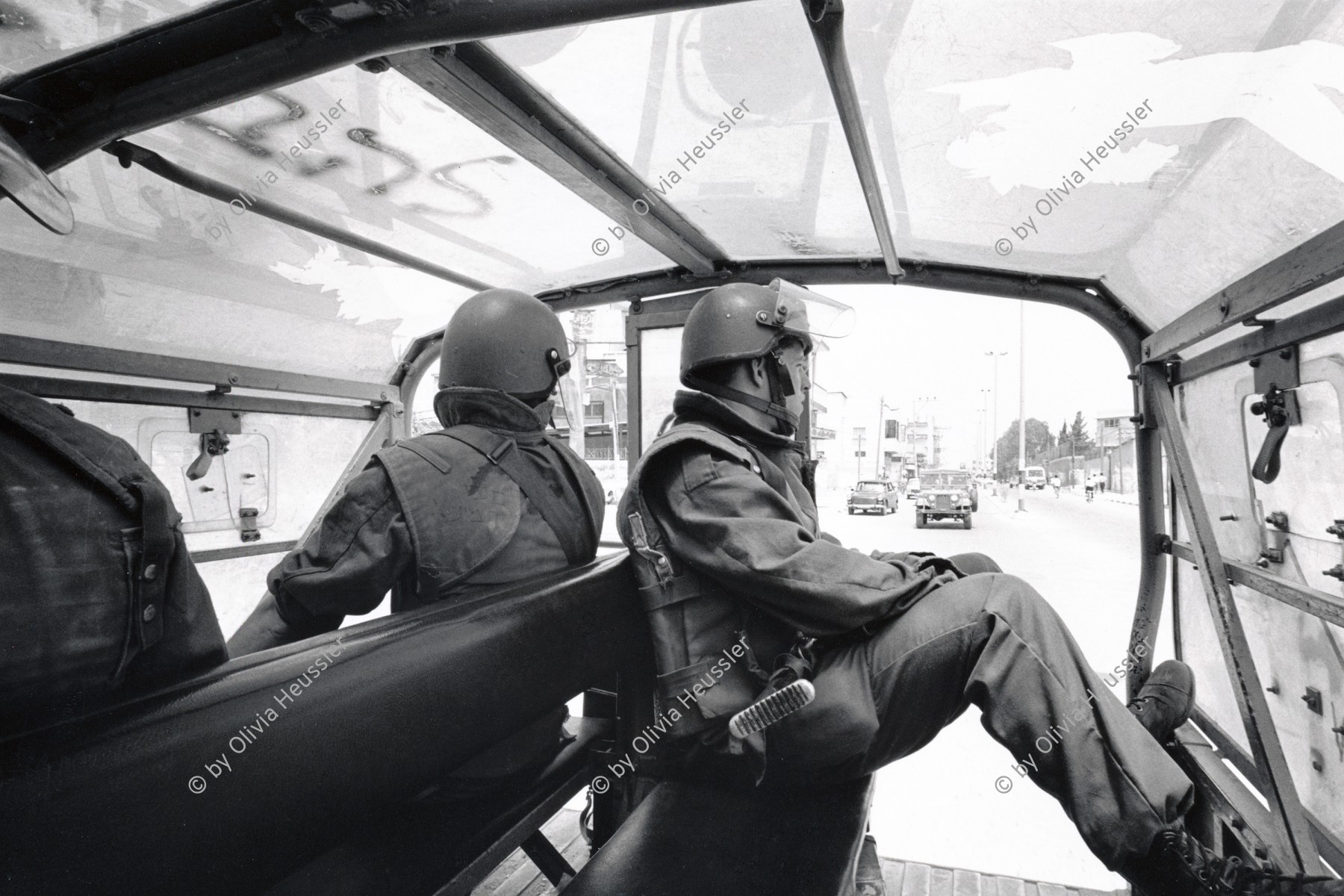 Image of sheet 19920450 photo 4: Patroullie Israelischer Artillerie-Soldaten im Al-Shate Camp. Palästina, Gaza Streifen 05.92
Military Patrol Israeli drives in Jeep through occupied territory Gaza Strip Palestine Al Shate Refugeecamp Refugees 1992 √ 
A patrol of Israeli artillery soldiers in Al Shate Camp.


Al-Shati camp (Arabic: مخيّم الشاطئ‎), also known as Beach camp, is a Palestinian refugee camp located in the northern Gaza Strip along the Mediterranean Sea coastline in the Gaza Governorate, and more specifically Gaza City. The camp's total land area consists of 727 dunums. According to the Palestinian Central Bureau of Statistics (PCBS), al-Shati had a population of 87,158 inhabitants in mid-year 2006, while the United Nations Relief and Works Agency (UNRWA) reports a population of 78,800 registered refugees. The camp is the third largest refugee camp in the Palestinian Territories 
© 1992, OLIVIA HEUSSLER / www.clic.li