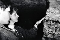 Image of sheet 19920600 photo 7: Swiss Esther Woerdehoff photo galery owner and colectioner, in den Katakomben in Paris, 09.92 1992 √ french France

The Catacombs of Paris or Catacombes de Paris are an underground ossuary in Paris, France. Located south of the former city gate (the "Barrière d'Enfer" at today's Place Denfert-Rochereau), the ossuary holds the remains of about six million people and fills a renovated section of caverns and tunnels that are the remains of Paris's stone mines. Opened in the late 18th century, the underground cemetery became a tourist attraction on a small scale from the early 19th century, and has been open to the public on a regular basis from 1874. Following an incident of vandalism, they were closed to the public in September 2009 and reopened 19 December of the same yea