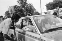 Image of sheet 19930500 photo 34: Roulette ambulante an der Vorbereitung zur Fiesta des Santo Dominguito in der
Kirche von Santo Domingo, Las Sierritas bei Managua. Karusell. mit Blechauto. Menschen sind verkleidet und tanzen in der Kirche. Beichtstuhl. Viele kriechen laut Tradition auf ihren blossen Knien zum Santos um ihren kranken Verwandten oder sich selbst Heilung zu versprechen. Ex Votos werden verkauft. Nicaragua 1993
