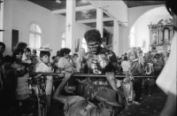 Image of sheet 19930520 photo 32: © 1993, Olivia Heussler / www.clic.li
Jedes Jahr wird für den heiligen Santo Domingo Dominguito in einer Kirche ein grosses Fest vorbereitet. Managua Nicaragua 1993 √

Every year, the churches nuns an people celebrating their holy Saint Domingo. 
En la iglesia «Las Sierritas». Santo Domingo, Dpto. de Managua, 1 de agosto de 1993

während:

Fiesta patronal en honor a Santo Domingo de Guzmán, patrón de Managua. Santo Domingo, Dpto. de Managua, 1 de agosto de 1993
Patron Saint’s Day festivities for Santo Domingo de Guzmán, the patron saint of Managua. Santo Domingo, Dep. Managua, August 1, 1993 √
