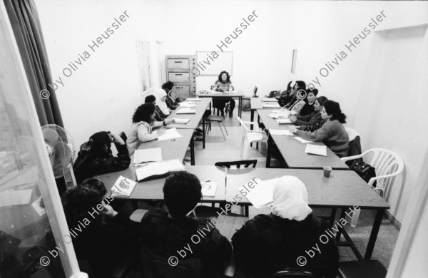 Image of sheet 19931220 photo 9: Damaskus Tor Ausstellung Out of Jerusalem im Centre Culturel Français an der Salah Eddin str. 21 in Ost-Jerusalem. Mit Marc Bouvier CICR und Esther Woerdehoff. Frauen lernen im YMCA Bissan Center for Woman Studies Ramallah.Esel und Ziegen und Schafe in einer Herde der Beduinen. Junge Frauen (schwarze)in Jericho Portrait. Arafat Graffitti in Jericho. In Friseursalon eines PLO Anhängers in Jericho. Arafat Graffiti in the streets of Jericho Palestine
 Hühnerhaltung zur Eierproduktion im Norden Gazas. Schuljunge in Gaza City Zentrum. 1993 Jerusalem Israel Palestine