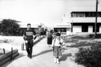 Image of sheet 19931230 photo 23: Jüdische Siedler in Neve Deqalim. Gazastreifen. Palästina 11.93

Jewish settler family school children Palestine Gaza strip 

Neve Dekalim (Hebrew: נְוֵה דְּקָלִים) (lit. "Oasis of Palms") was an Israeli settlement and a community in the Gush Katif settlement bloc in the Gaza Strip. It was founded in 1983 after the Israeli withdrawal from the Sinai Peninsula, on uninhabited sand dunes. Neve Dekalim served as a regional center for the Gush Katif region and was the seat of the Hof Aza Regional Council. It was located between the former Egyptian town of Khan Yunis and the Mediterranean Sea. ]Neve Dekalim was evacuated in August 2005 as part of Israel's unilateral disengagement plan. It was turned into a terrorist training camp by Hamas.


© 1993, Olivia Heussler √