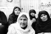 Image of sheet 19931240 photo 9: Frauen trauern um den Tod des Al Fatah Kaempfers, der nachdem er sich beim israelischen Militär ergeben hatte, von diesem erschossen wurde, Khan Yunis, Gaza 1993.

Khan Yunis Camp (Arabic: مخيم خان يونس‎, also spelled Khan Younis Camp) is a Palestinian refugee camp in the Khan Yunis Governorate just west of the city of Khan Yunis and two kilometers east of the Mediterranean coast in the southern Gaza Strip. While UNRWA states that there were approximately 72,000 Palestinian refugees living in the camp in 2010, the Palestinian Central Bureau of Statistics recorded a population of 37,705 in the 2007 census.

© 1993, Olivia Heussler √