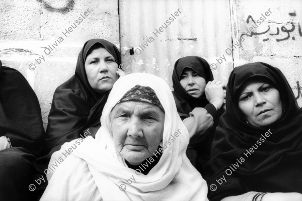 Image of sheet 19931240 photo 9: Frauen trauern um den Tod des Al Fatah Kaempfers, der nachdem er sich beim israelischen Militär ergeben hatte, von diesem erschossen wurde, Khan Yunis, Gaza 1993.

Khan Yunis Camp (Arabic: مخيم خان يونس‎, also spelled Khan Younis Camp) is a Palestinian refugee camp in the Khan Yunis Governorate just west of the city of Khan Yunis and two kilometers east of the Mediterranean coast in the southern Gaza Strip. While UNRWA states that there were approximately 72,000 Palestinian refugees living in the camp in 2010, the Palestinian Central Bureau of Statistics recorded a population of 37,705 in the 2007 census.

© 1993, Olivia Heussler √