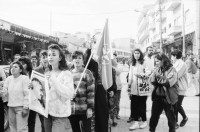 Image of sheet 19931250 photo 12: Portrait Maha Nasser an Demo zum 26. Geburtstag von Georges Habasch's PLFP Frauen tragen sein Portrait People's Liberation Front of Palestine. in Ramallah West Bank Tränengas Einsatz brennende Autoreifen . Esther Woerdehoff im Gespräch mit Maha zu Hause mit ihrem jüngsten Sohn Husem 1 1/2 jährig. Auf Transpi Color Long life the Pop. Front at his Aniversery. Ramallah Palestine Palästina 1993