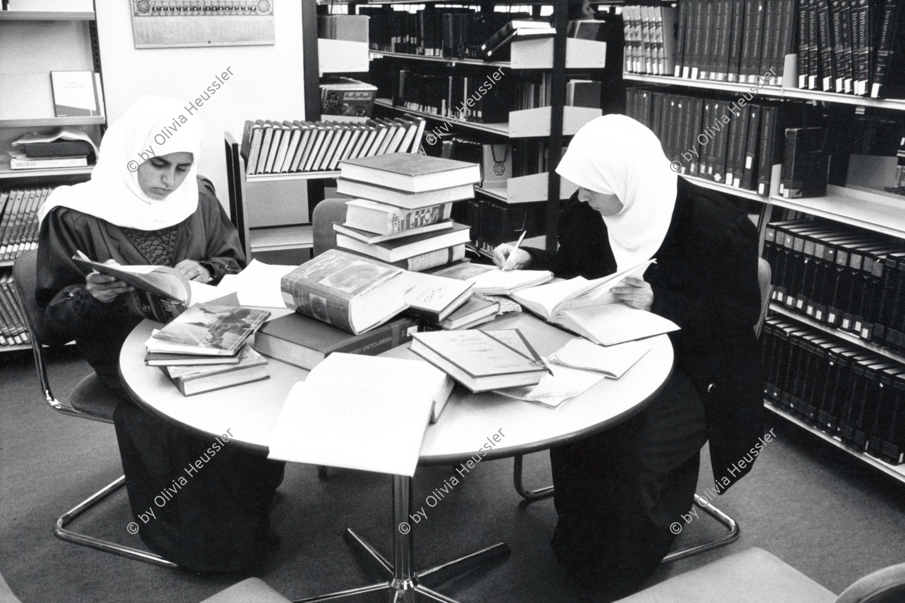 Image of sheet 19931260 photo 4: Zei Studentinnen arbeiten in der Bibliothek der Uni Bir Zeit. Westbank 12.93 √ 1993 Palestine Bibliotheque students female arab muslim University occupied territory
Birzeit University (BZU) (Arabic: جامعة بيرزيت‎) is a public university located in Birzeit near Ramallah, Palestine. BZU is among the foremost tertiary educational institutes in Palestine and has played a significant role in the Palestinian political dialogue. It is the first institution of higher education to be established in the Palestine and is considered as one of the most prestigious universities in the West Bank.Furthermore, BZU has the highest admission averages among other Palestinian universities.
© 1993, Olivia Heussler