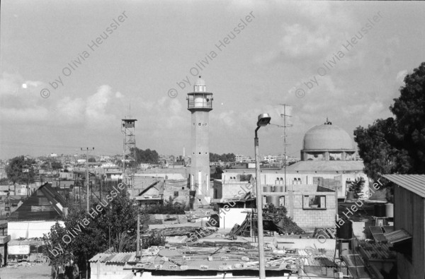 Image of sheet 19931310 photo 8: frtsg. 931300 Portrait Yussra Barbari. Portrait. Gaza Uebersicht auf die Dächer in Jabalia Camp. Jabalia. kids. Gaza strip
Jabalia Camp (Arabic: مخيّم جباليا‎) is a Palestinian refugee camp located 3 kilometers (1.9 mi) north of Jabalia. The refugee camp is in the North Gaza Governorate, Gaza Strip. According to the Palestinian Central Bureau of Statistics, the camp had a population of 93,455 in mid-year 2006