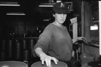 Image of sheet 19931400 photo 15: Fitnessclub. Frau. Altersheim. beim Billard spielen. Portrait Michal Amir, 23 ig. Kibbutz Sarid, 30099 06 548120 Israel arbeitet in Fabrik Flex. Portrait mit Fahrrad Velo und während ihrer Arbeit an einer Presse  Michal raucht 1993 Israel Palestine Frau Women work industry bicycle worker work Arbeit young 

A kibbutz (Hebrew: קִבּוּץ / קיבוץ, lit. "gathering, clustering"; plural kibbutzim) is a collective community in Israel that was traditionally based on agriculture. Today, farming has been partly supplanted by other economic branches, including industrial plants and high-tech enterprises.[1] Kibbutzim began as utopian communities, a combination of socialism and Zionism. In recent decades, some kibbutzim have been privatized and changes have been made in the communal lifestyle. A member of a kibbutz is called a kibbutznik (Hebrew: קִבּוּצְנִיק).

Kibbutz Sarid (Hebrew: שָׂרִיד) (lit. "Remnant") is a kibbutz in northern Israel. Located near Migdal HaEmek, it falls under the jurisdiction of Jezreel Valley Regional Council. In 2006 it had a population of 590