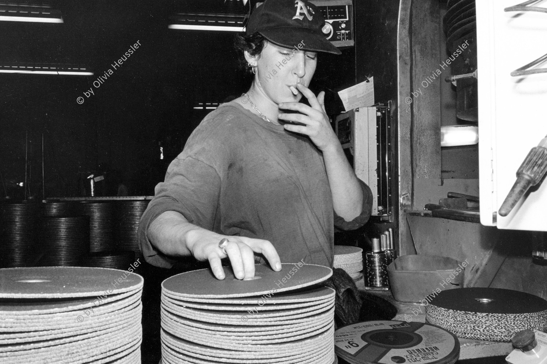 Image of sheet 19931400 photo 17: Michal, 23, arbeitet rauchend in der Fabrik zur Herstellung von Schleifblätter, Kibbutz Sarid, Israel 1993. 
woman young work working industry smoke

Kibbutz Sarid (Hebrew: שָׂרִיד) (lit. "Remnant") is a kibbutz in northern Israel. Located near Migdal HaEmek, it falls under the jurisdiction of Jezreel Valley Regional Council. In 2006 it had a population of 590