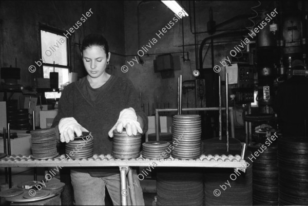 Image of sheet 19931400 photo 21: Fitnessclub. Frau. Altersheim. beim Billard spielen. Portrait Michal Amir, 23 ig. Kibbutz Sarid, 30099 06 548120 Israel arbeitet in Fabrik Flex. Portrait mit Fahrrad Velo und während ihrer Arbeit an einer Presse  Michal raucht 1993 Israel Palestine Frau Women work industry bicycle worker work Arbeit young 

A kibbutz (Hebrew: קִבּוּץ / קיבוץ, lit. "gathering, clustering"; plural kibbutzim) is a collective community in Israel that was traditionally based on agriculture. Today, farming has been partly supplanted by other economic branches, including industrial plants and high-tech enterprises.[1] Kibbutzim began as utopian communities, a combination of socialism and Zionism. In recent decades, some kibbutzim have been privatized and changes have been made in the communal lifestyle. A member of a kibbutz is called a kibbutznik (Hebrew: קִבּוּצְנִיק).

Kibbutz Sarid (Hebrew: שָׂרִיד) (lit. "Remnant") is a kibbutz in northern Israel. Located near Migdal HaEmek, it falls under the jurisdiction of Jezreel Valley Regional Council. In 2006 it had a population of 590