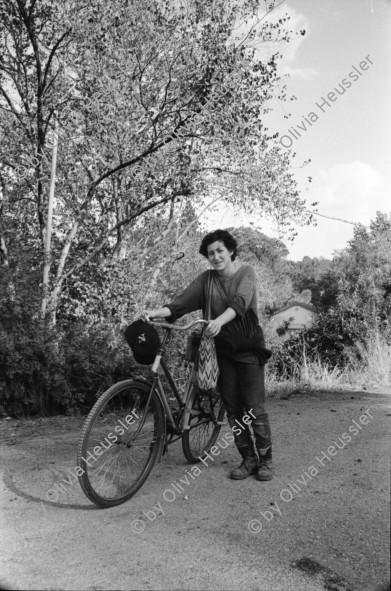 Image of sheet 19931400 photo 34: Fitnessclub. Frau. Altersheim. beim Billard spielen. Portrait Michal Amir, 23 ig. Kibbutz Sarid, 30099 06 548120 Israel arbeitet in Fabrik Flex. Portrait mit Fahrrad Velo und während ihrer Arbeit an einer Presse  Michal raucht 1993 Israel Palestine Frau Women work industry bicycle worker work Arbeit young 

A kibbutz (Hebrew: קִבּוּץ / קיבוץ, lit. "gathering, clustering"; plural kibbutzim) is a collective community in Israel that was traditionally based on agriculture. Today, farming has been partly supplanted by other economic branches, including industrial plants and high-tech enterprises.[1] Kibbutzim began as utopian communities, a combination of socialism and Zionism. In recent decades, some kibbutzim have been privatized and changes have been made in the communal lifestyle. A member of a kibbutz is called a kibbutznik (Hebrew: קִבּוּצְנִיק).

Kibbutz Sarid (Hebrew: שָׂרִיד) (lit. "Remnant") is a kibbutz in northern Israel. Located near Migdal HaEmek, it falls under the jurisdiction of Jezreel Valley Regional Council. In 2006 it had a population of 590