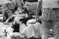 Image of sheet 19940010 photo 1: Englische touristen mit Beduinen. In Dahab gibt es nach starkem Regen
heftige überschwemmungen. Hochwasser. René Suter und Olivia Heussler mit Hotel angestellter im Hotelzimmer auf Bett, Matratze steht. Sinai ehemaliger Moshav Aegypten Egypt 1994 flood
Dahab (Egyptian Arabic: دهب or ذهب,IPA: [ˈdæhæb], gold) is a small town situated on the southeast coast of the Sinai Peninsula in Egypt. Formerly a Bedouin fishing village, located approximately 80 km (50 mi) northeast of Sharm el-Sheikh, Dahab is considered to be one of the Sinai's most treasured diving destinations. Following the Six Day War, the town was occupied by Israel and was known in Hebrew as Di-Zahav; named after a place mentioned in the Bible