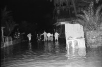 Image of sheet 19940010 photo 6: Englische touristen mit Beduinen. In Dahab gibt es nach starkem Regen
heftige überschwemmungen. Hochwasser. René Suter und Olivia Heussler mit Hotel angestellter im Hotelzimmer auf Bett, Matratze steht. Sinai ehemaliger Moshav Aegypten Egypt 1994 flood
Dahab (Egyptian Arabic: دهب or ذهب,IPA: [ˈdæhæb], gold) is a small town situated on the southeast coast of the Sinai Peninsula in Egypt. Formerly a Bedouin fishing village, located approximately 80 km (50 mi) northeast of Sharm el-Sheikh, Dahab is considered to be one of the Sinai's most treasured diving destinations. Following the Six Day War, the town was occupied by Israel and was known in Hebrew as Di-Zahav; named after a place mentioned in the Bible