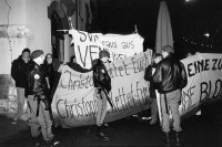 Image of sheet 19940090 photo 26: Demonstration Protest gegen SVP-Nationalrat Blocher vor dem Eingang des Albisgüetli, wo die Partei die traditionelle Tagung abhält. Zürich, 28.01.94

The Swiss People's Party (German: Schweizerische Volkspartei, SVP), also known as the Democratic Union of the Centre (Italian: Unione Democratica di Centro, French: Union démocratique du centre, UDC), is a national conservative and right-wing populist political party in Switzerland. Chaired by Toni Brunner, but spearheaded by Christoph Blocher, the party is the largest party in the Federal Assembly, with 54 members of the National Council and 5 of the Council of States.