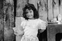 Image of sheet 19940370 photo 1: Mailing isst seit kurzem gerne Matzen. Sie sind Teil einer Schenkung aus Nordamerika. Esteli Nicaragua 09.94

girl food help matzo

Matze (hebr. ‏מצה‎, matzá; dt. Matze; Plural hebr. ‏מצות‎, matzót; dt. Matzen - auch jiddisch ‏מצה‎, mátze; dt. Matze; Plural jiddisch ‏מצות‎, mátzes; dt. Matzen), auch ungesäuertes Brot genannt, ist ein dünner Brotfladen, der von religiösen und traditionsverbundenen Juden während des Pessachfestes gegessen wird. Matze wird aus Wasser und einer der fünf Getreidearten Weizen, Roggen, Gerste, Hafer oder Dinkel ohne Triebmittel gefertigt.

Matzo or matzah (Hebrew: מַצָּה‎; with many other spellings in English, plural matzot) is an unleavened bread traditionally eaten by Jews during the week-long Passover holiday, when eating chametz—bread and other food which is made with leavened grain—is forbidden according to Jewish law. Currently, the most ubiquitous type of matzo is the traditional Ashkenazic type, which is hard like a cracker. However, some Mizrahi Jews have traditionally prepared matzo as a soft and pliable type of flat bread, and these "soft matzos" have recently[when?] regained some popularity. Matzo is eaten by Jews as an obligation during the Passover Seder meal; during the rest of the holiday its consumption is optional, though customary, as only unleavened bread may be eaten.

© 1994, Olivia Heussler √