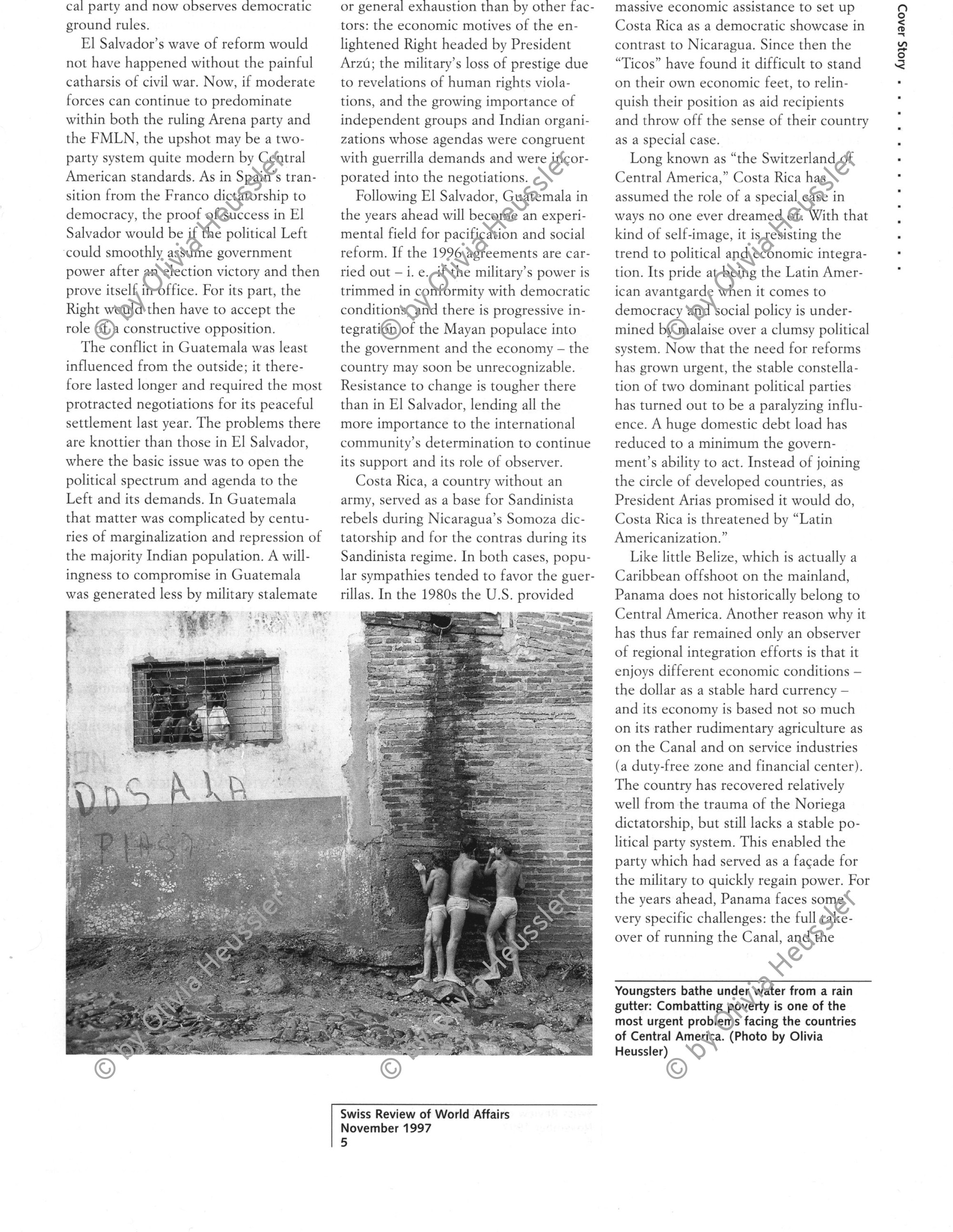 Image of sheet 19940660 photo 17: Boys showering in the water of the gutter, La Olota Nicaragua 1994.