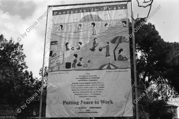 Image of sheet 19960070 photo 4: 'Putting Peace to Work' Plakat beim American Colony Hotel der European Union, Jerusalem 1996.