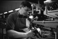 Image of sheet 19960350 photo 3: Worker in a shoe factory when polishing shoes