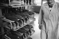 Image of sheet 19960350 photo 4: Worker in a shoe factory when polishing shoes