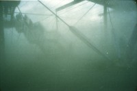 Image of sheet 20020200 photo 18: Die Expo.02 war die 6. Schweizer Landesausstellung und fand vom 15. Mai bis zum 20. Oktober 2002 im Drei-Seen-Land statt. Die Ausstellung bestand hauptsächlich aus fünf Arteplage genannten Ausstellungsgeländen, welche an den Seeufern der Städte Biel/Bienne, Murten, Neuenburg und Yverdon-les-Bains ausschliesslich für die Dauer der Exposition errichtet wurden; die fünfte Arteplage war eine umgebaute Kiesbarke, Arteplage mobile du Jura genannt, die zwischen den restlichen Arteplages verkehrte. Dabei vertrat jede Arteplage einen der fünf Organisations-Kantone Bern, Jura, Freiburg, Neuenburg und Waadt.
Ausflug Expo.02 mit Redaktion der Schweizer Familie Tamedia Schiff nach Neuenburg Sicht vom See 
Balz Fingerhuth Nebel Wolke Yverdon les Bains Plastikmantel Alis Heussler 4 1/2 jährig 2002 

Expo.02 was the 6th Swiss national exposition, which was held from 15 May to 20 October 2002. The exposition took place around the lakes of Neuchâtel, Bienne/Biel and Morat/Murten. It was divided into five sites, which were called Arteplages, due to the proximity of the water (some sites were actually partially or totally built on the water). The five Arteplages were located in Neuchâtel, Yverdon-les-Bains, Morat/Murten, Biel/Bienne and on a mobile barge traveling from one site to another. The barge represented the canton of Jura, which does not have access to any one of the three lakes.