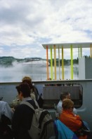 Image of sheet 20020200 photo 28: Die Expo.02 war die 6. Schweizer Landesausstellung und fand vom 15. Mai bis zum 20. Oktober 2002 im Drei-Seen-Land statt. Die Ausstellung bestand hauptsächlich aus fünf Arteplage genannten Ausstellungsgeländen, welche an den Seeufern der Städte Biel/Bienne, Murten, Neuenburg und Yverdon-les-Bains ausschliesslich für die Dauer der Exposition errichtet wurden; die fünfte Arteplage war eine umgebaute Kiesbarke, Arteplage mobile du Jura genannt, die zwischen den restlichen Arteplages verkehrte. Dabei vertrat jede Arteplage einen der fünf Organisations-Kantone Bern, Jura, Freiburg, Neuenburg und Waadt.
Ausflug Expo.02 mit Redaktion der Schweizer Familie Tamedia Schiff nach Neuenburg Sicht vom See 
Balz Fingerhuth Nebel Wolke Yverdon les Bains Plastikmantel Alis Heussler 4 1/2 jährig 2002 

Expo.02 was the 6th Swiss national exposition, which was held from 15 May to 20 October 2002. The exposition took place around the lakes of Neuchâtel, Bienne/Biel and Morat/Murten. It was divided into five sites, which were called Arteplages, due to the proximity of the water (some sites were actually partially or totally built on the water). The five Arteplages were located in Neuchâtel, Yverdon-les-Bains, Morat/Murten, Biel/Bienne and on a mobile barge traveling from one site to another. The barge represented the canton of Jura, which does not have access to any one of the three lakes.