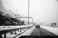 Image of sheet 20020730 photo 12: Autokolonne am Gotthard Suedportal in Airolo Gotthard Nordseite mit Schnee auf Autostrasse 
Badi Enge tische gedeckt Austern stechen bei Suedhang mit mathis pilloud in Zürich
Kiesaushub in amsteg Nordportal Neat  nr. 31 Adolf Ogi gibt interview