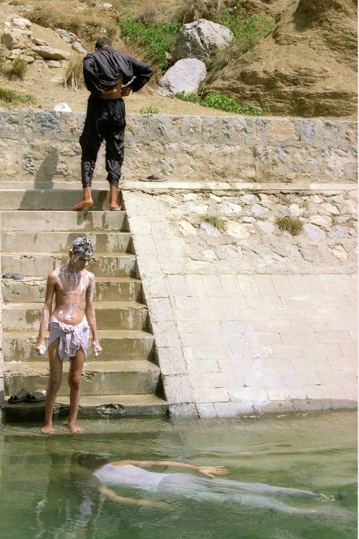 Image of sheet 20030120 photo 34: Mens are taking a bath in the Khanpur aquadukt near Jaulian wich brings fresh water to the Capital of Islamabad .23/05/2003