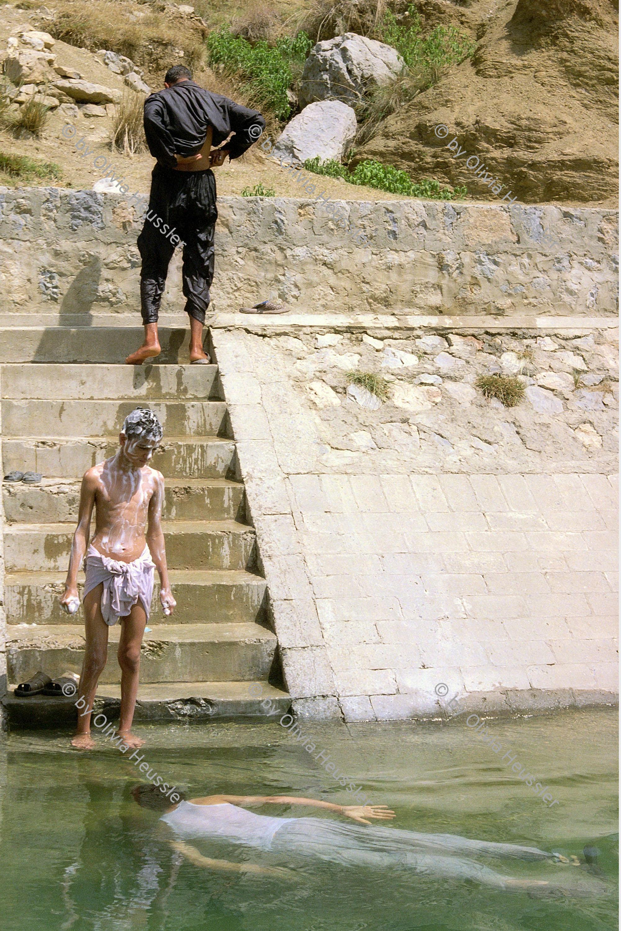 Image of sheet 20030120 photo 34: Mens are taking a bath in the Khanpur aquadukt near Jaulian wich brings fresh water to the Capital of Islamabad .23/05/2003